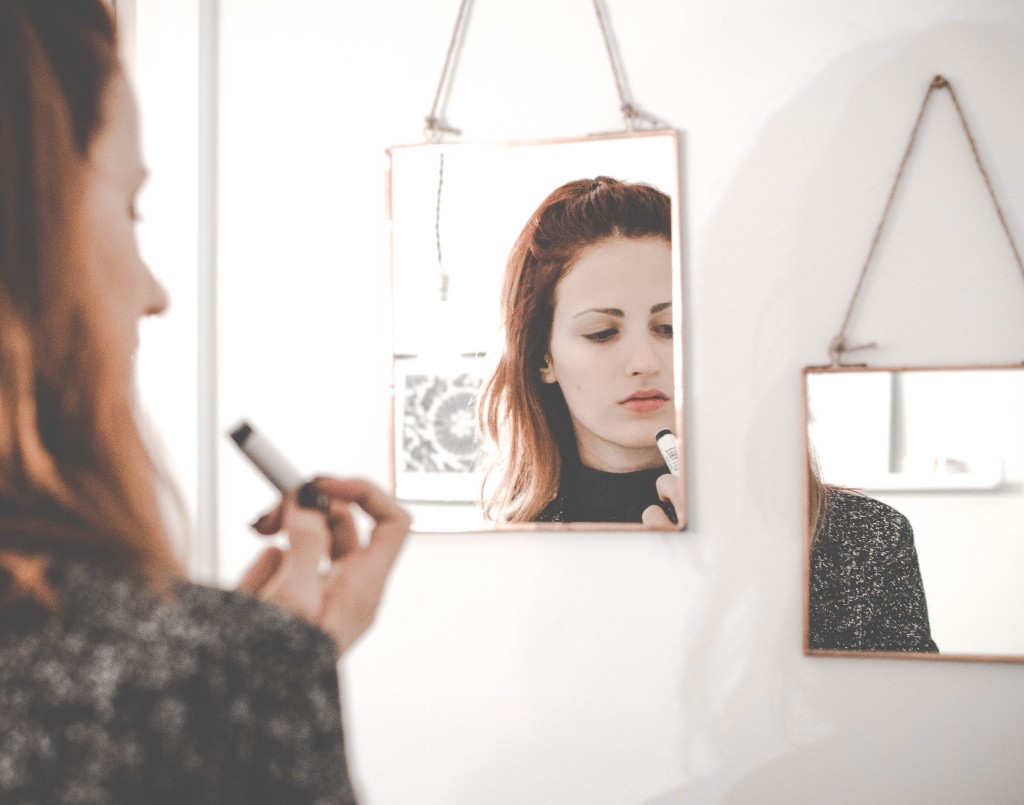 Photo of a girls reflection in a mirror