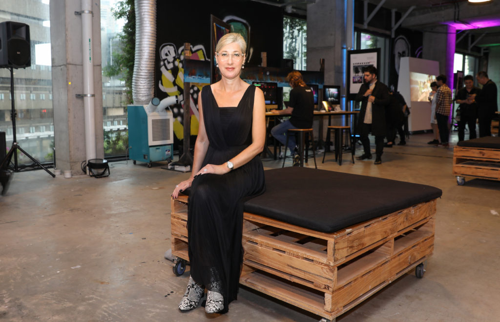 Jade Cosgrove sitting in Ambush Gallery waiting for the Raffles College of Design graduate runway for emerging designers to start 2016.