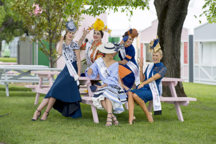 Five national competitors for the Victorian Spring Racing Carnival. Alice Bright, Courtney Moore, Inessa McIntyre, Regina Thei, Ashleigh Jane, all sitting under a tree.